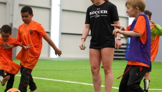 UNK soccer player Sarah Levy officiates a game during TOPSoccer.