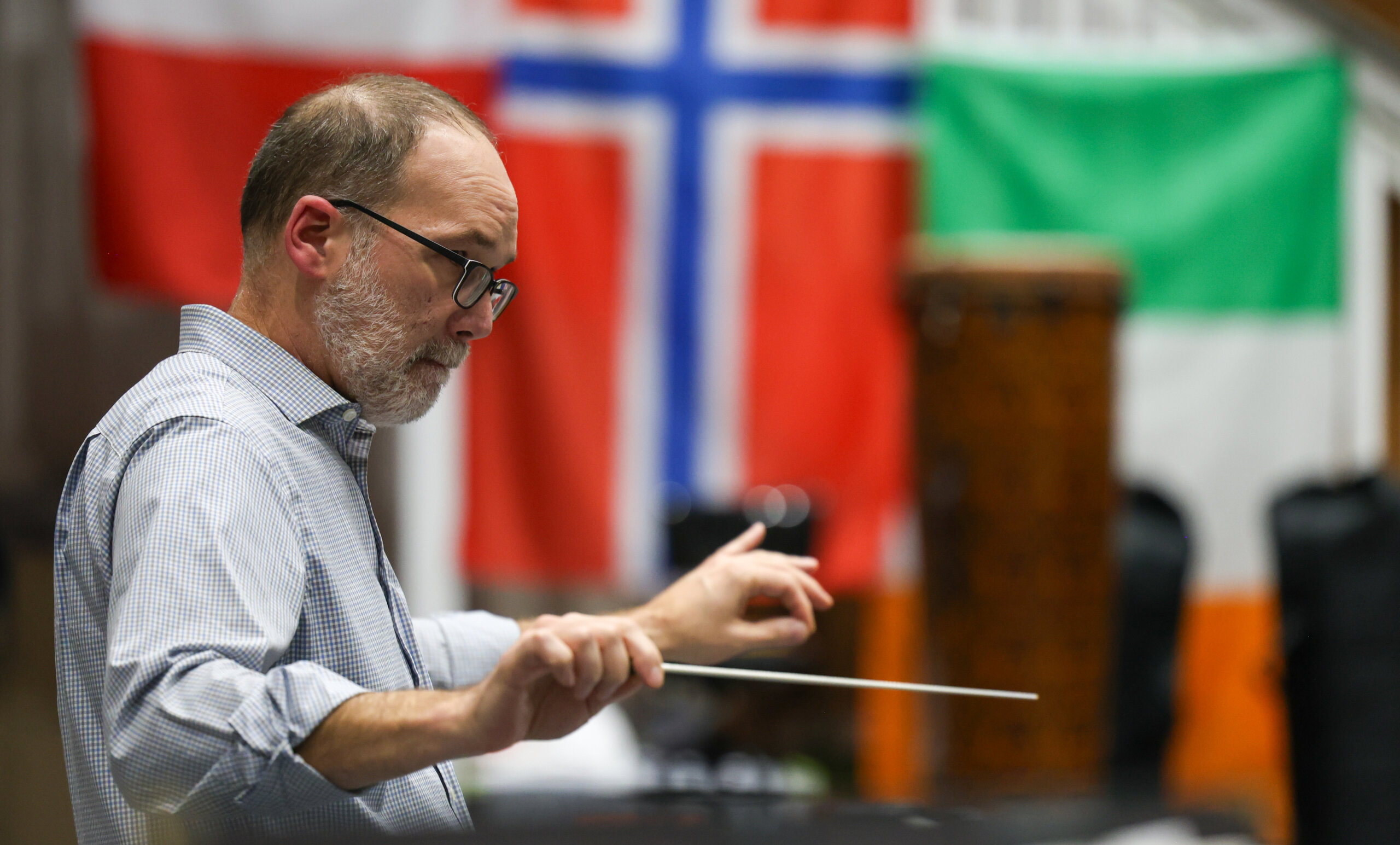 A man conducts a band.