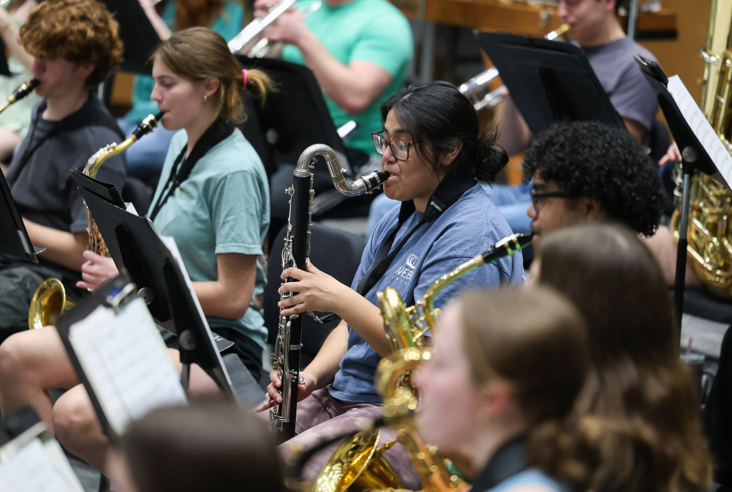 Students play musical instruments.