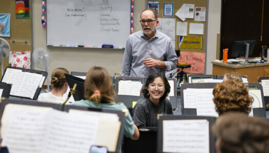 Director of Bands Duane Bierman interacts with the Wind Ensemble during practice (Wind Ensemble band members practice a musical piece (Photo by Erika Pritchard, UNK Communications).