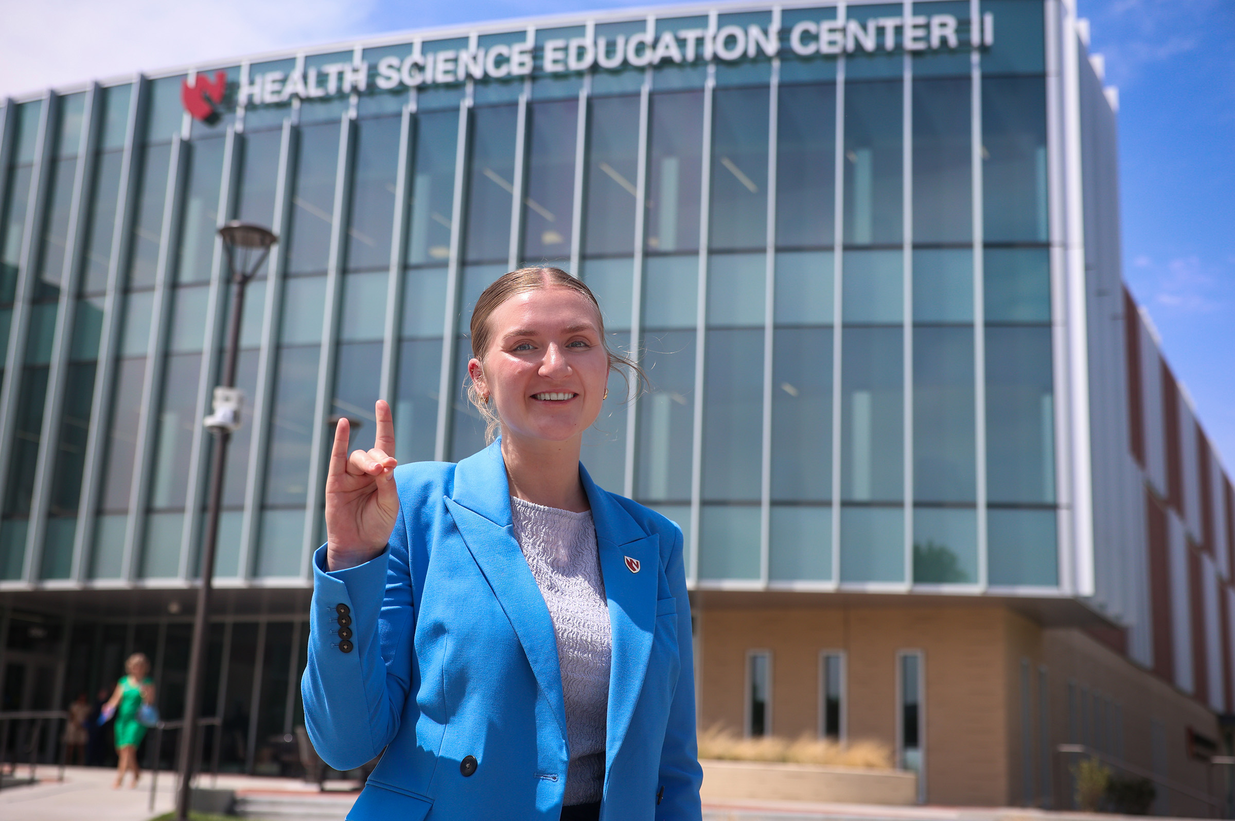 Allie Daro poses for a photo outside the new Health Science Education Center II on the UNK campus.