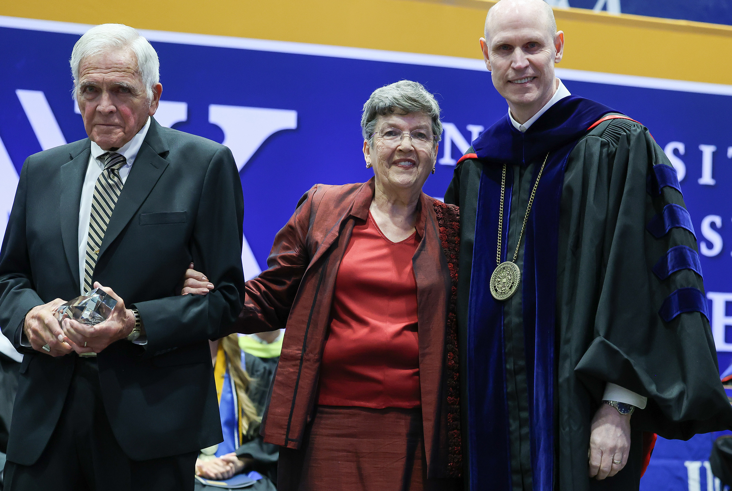 Keith and Eileen Carpenter are recognized with the Ron and Carol Cope Cornerstone of Excellence Award during UNK's spring commencement.