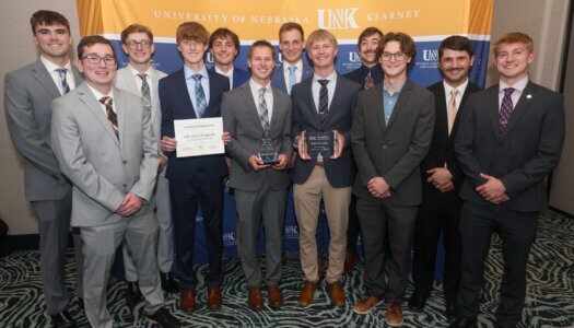 Delta Tau Delta with their awards.