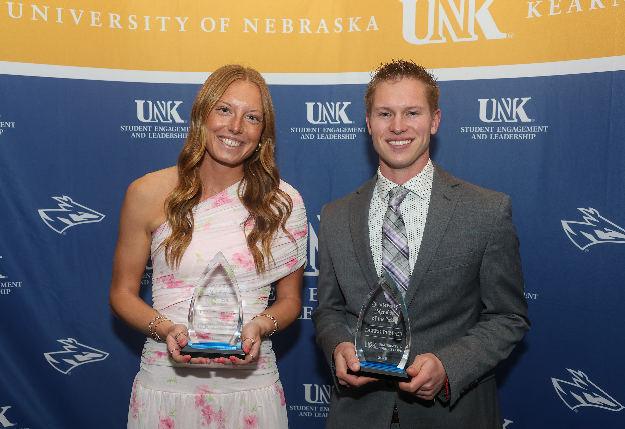 Jenna Rauert and Derek Pfeifer pose with their awards.
