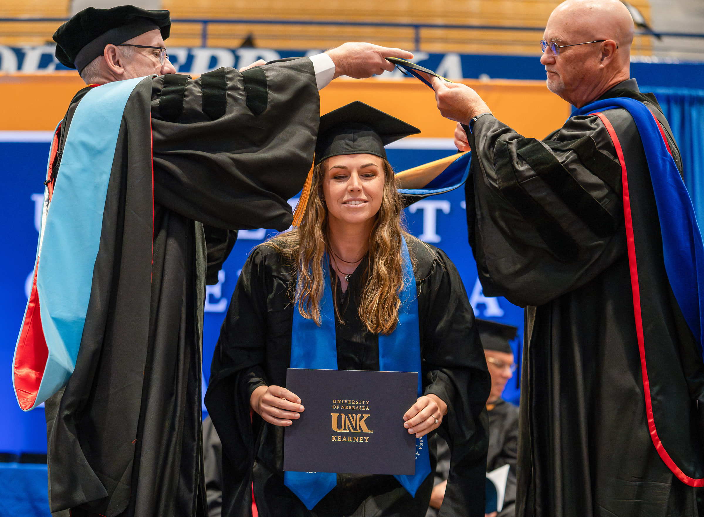 Leighlynn Towne receives her degree during UNK's spring commencement.