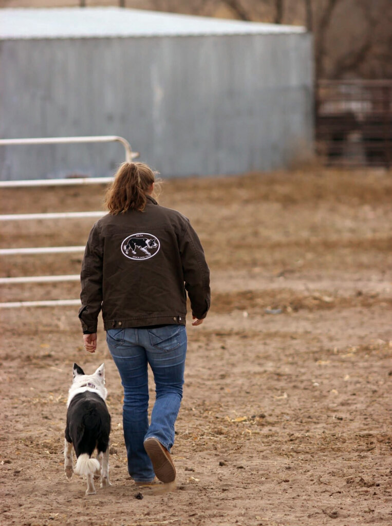 Leighlynn Towne and one of her stock dogs on the ranch.