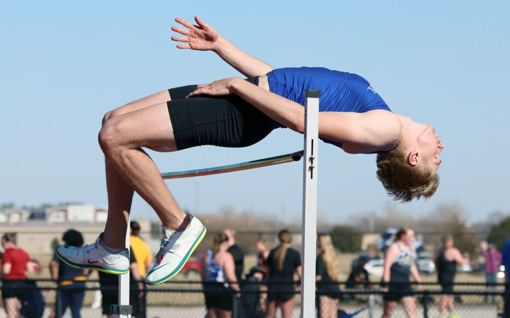 Luke Brachle competes in the high jump.