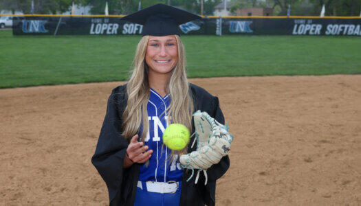 Mary Chvatal poses for a graduation photo at Dryden Park.