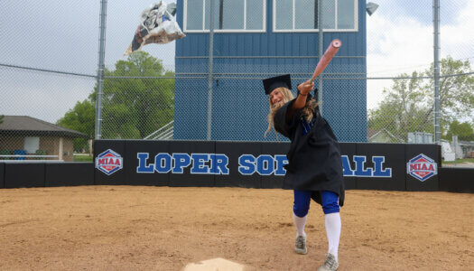 Mary Chvatal poses for a graduation photo at Dryden Park.