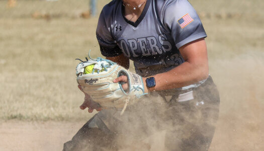 Mary Chvatal fields a grounder.