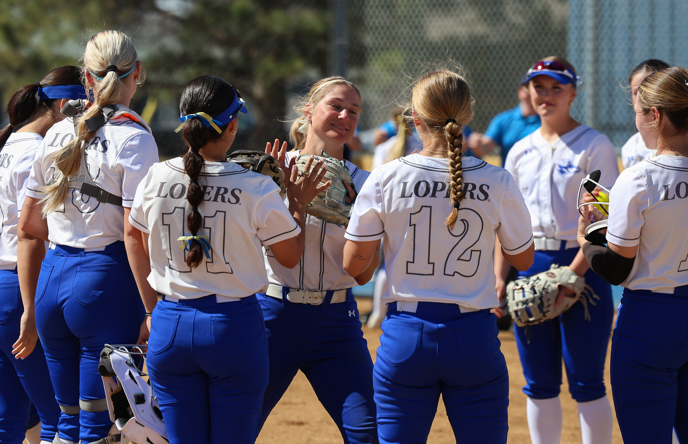 Mary Chvatal high-fives her teammates.