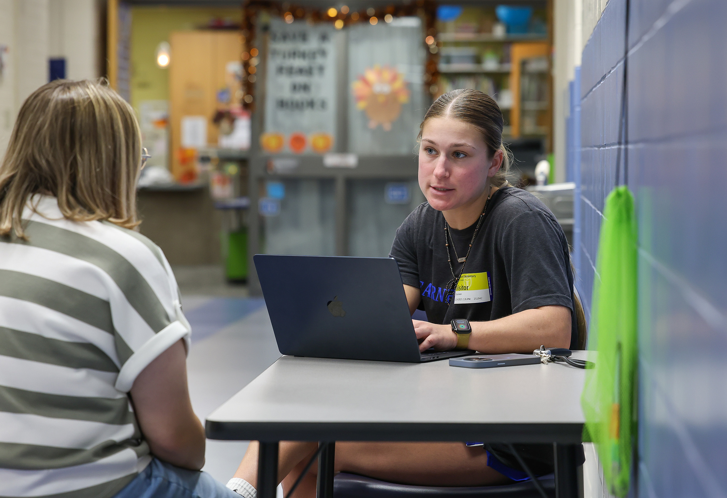 Mary Chvatal interviews a fellow UNK student while working for UNK Communications and Marketing.