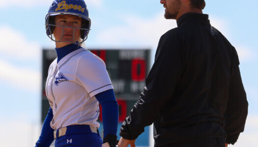 Mary Chvatal stands on first base.