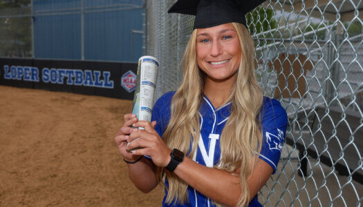 Mary Chvatal poses for a graduation photo at Dryden Park.