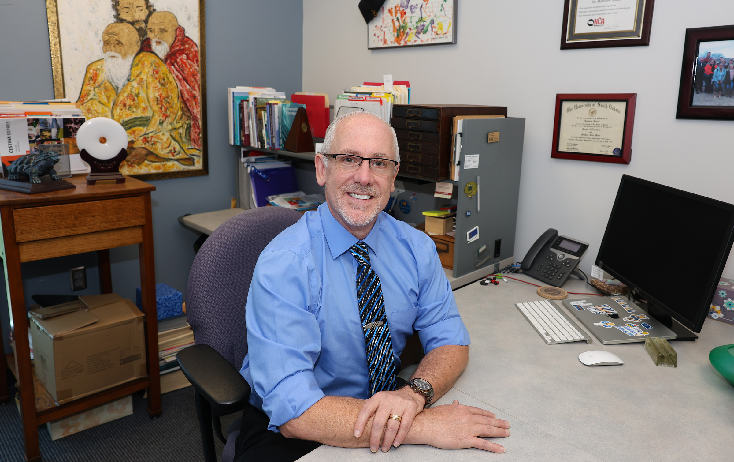Matt Mims poses for a photo in his office.