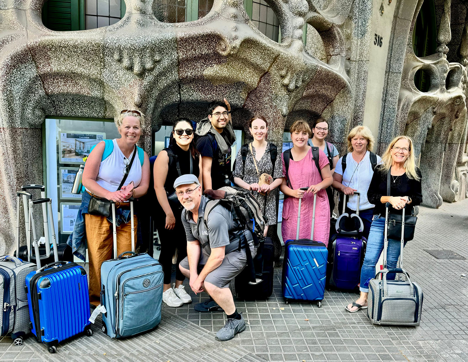 Matt and Grace Mims pose for a photo with students during a study abroad trip in Barcelona, Spain.
