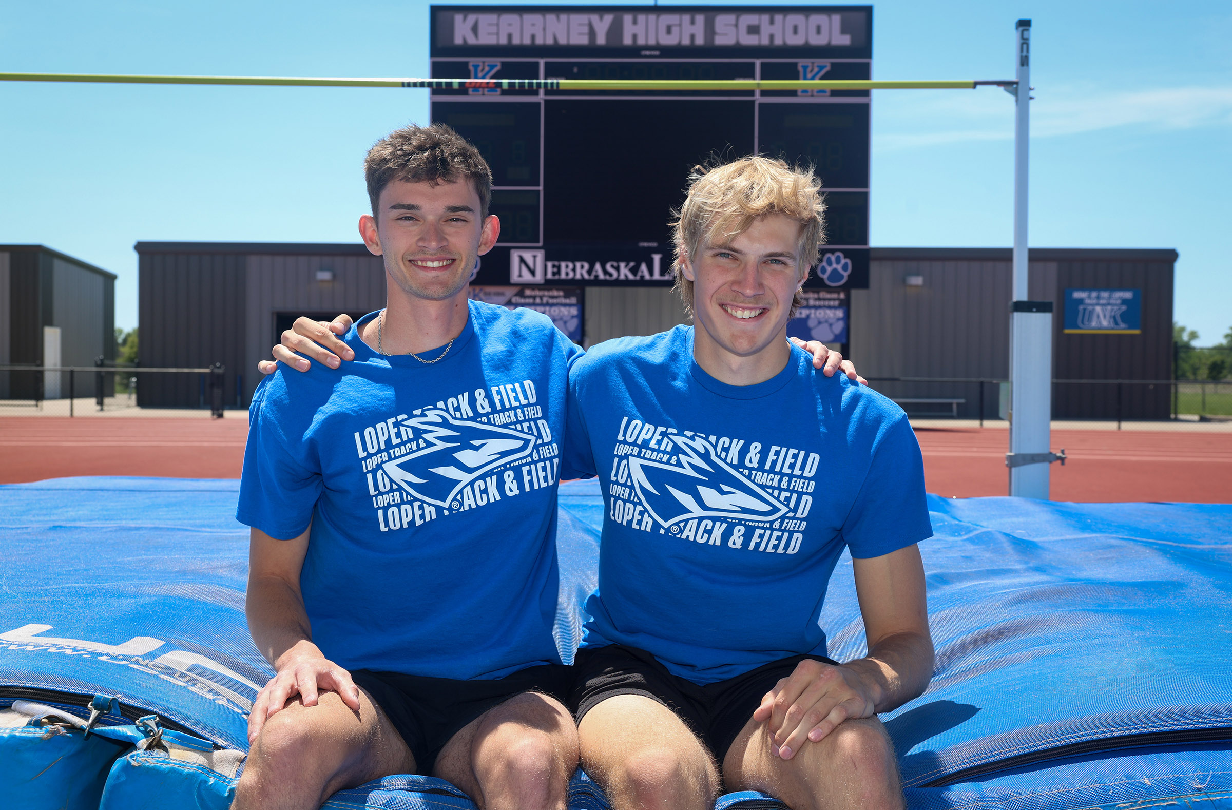 Nolan Studley and Luke Brachle pose for a photo at the Kearney High School track.