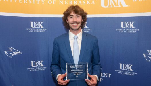 Quinten Clausen receives the Outstanding Fraternity New Member Award.
