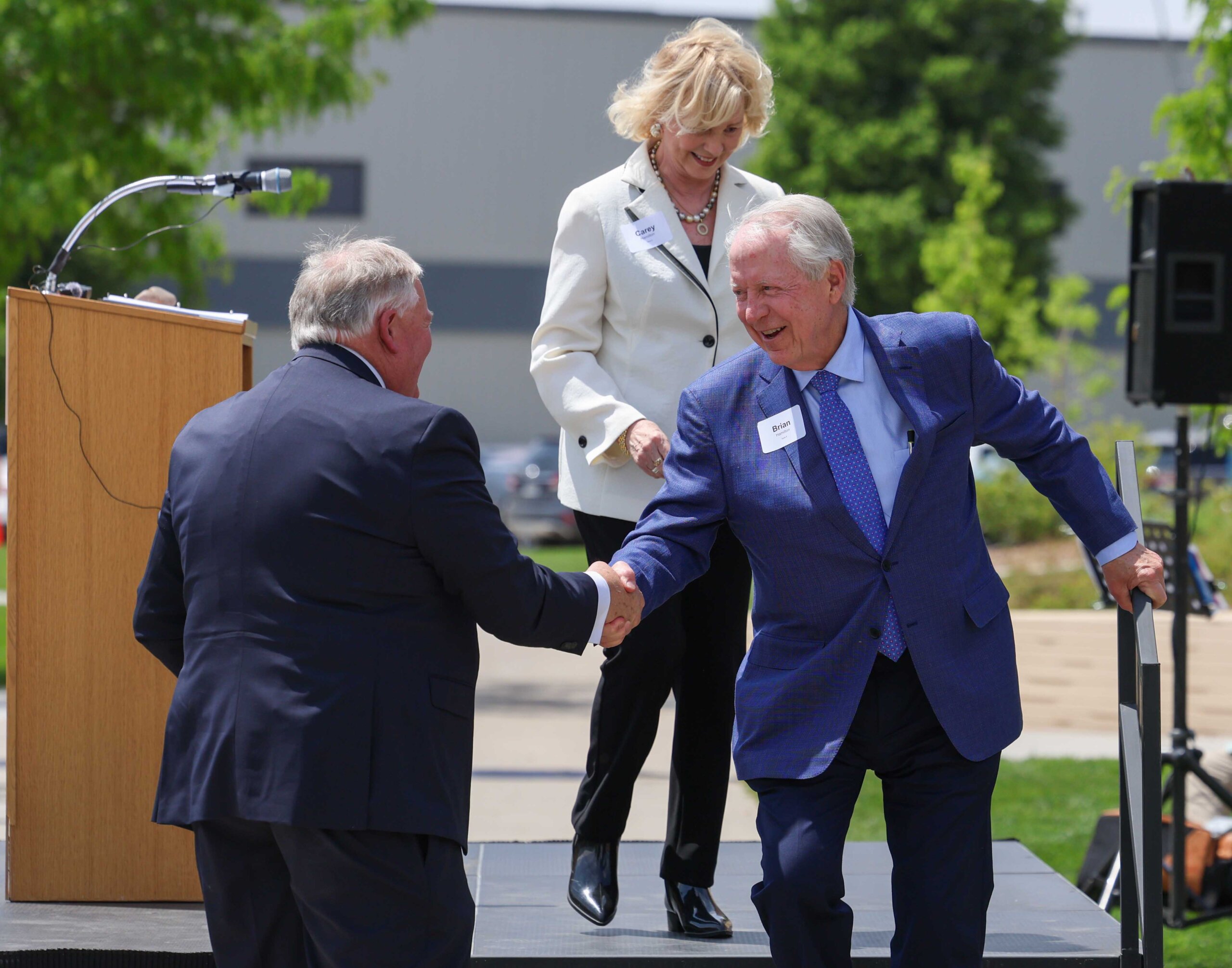 Doug Kristensen and Brian Hamilton shake hands during the Douglas A. Kristensen Rural Health Education Complex grand opening ceremony.