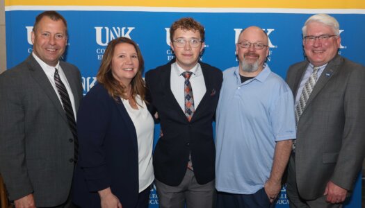 Alex Worm with his family, KPS Superintendent Jason Mundorf and UNK College of Education Dean Mark Reid.