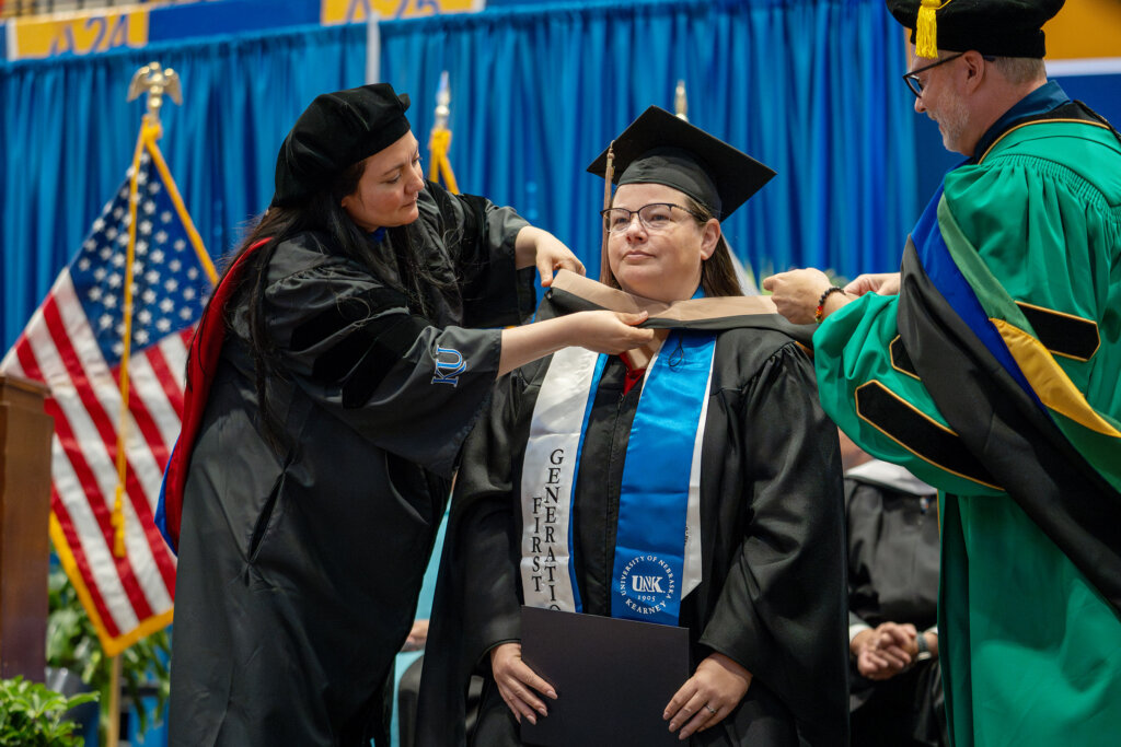 Kathy Welte receives her MBA during UNK's spring commencement.