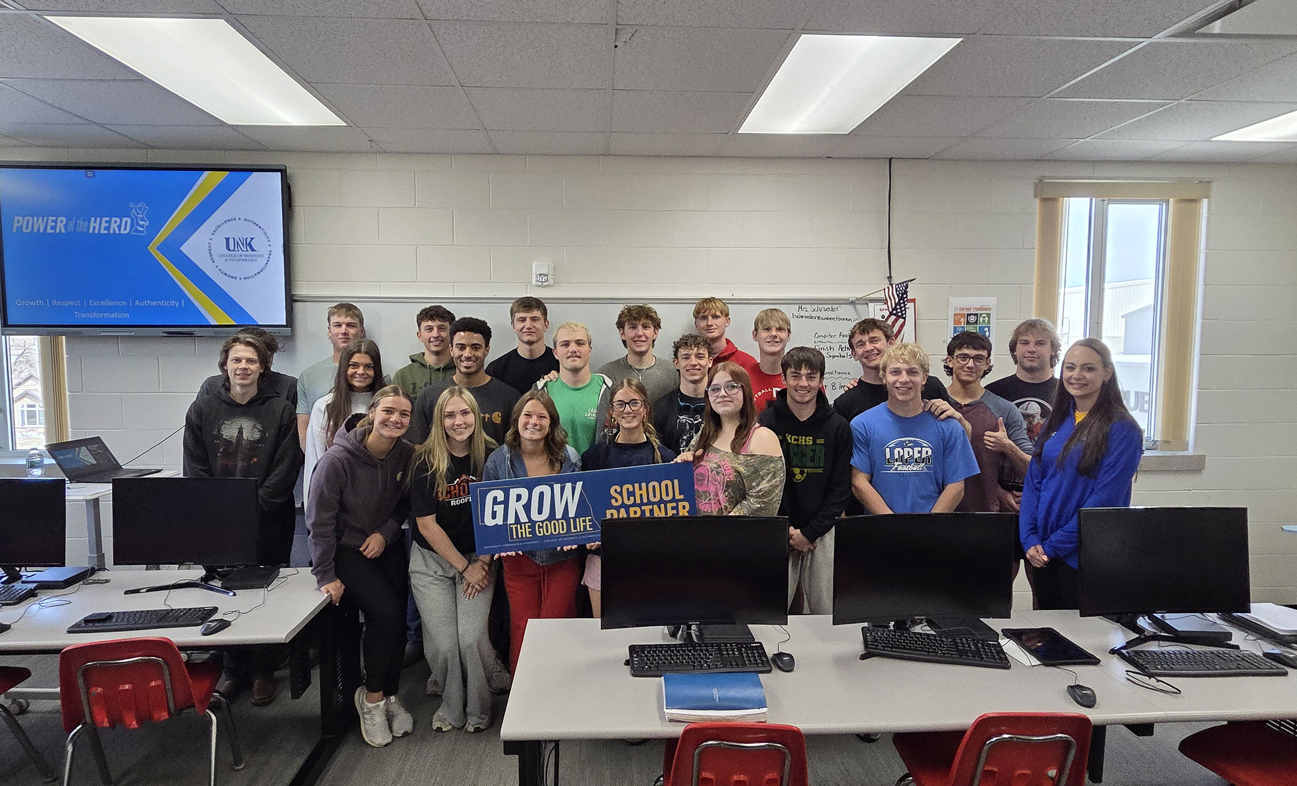 Mandy Sand is pictured with students at Amherst Public Schools.