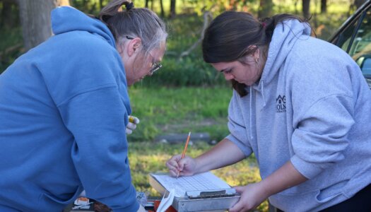 Letty Reichart and Morgan Holm collect data at Rowe Sanctuary.