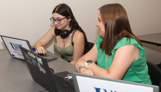 A student logs into her UNK account.