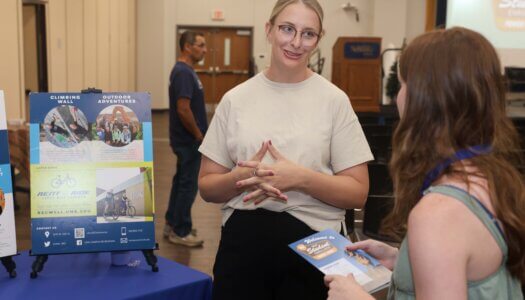 Students and their families learn about campus offerings at a resource fair.