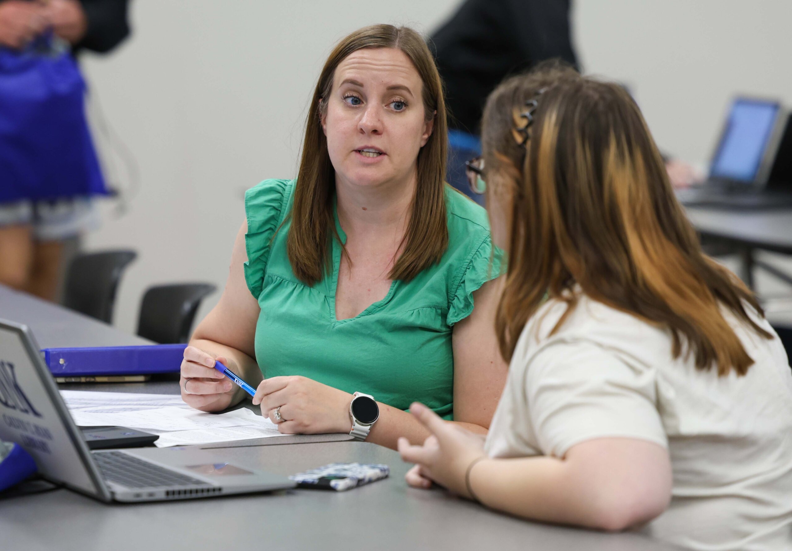 Emily Beaman of Career Development enrolls a student for classes.