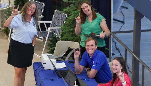 UNK staff throw their lopes at NSE.