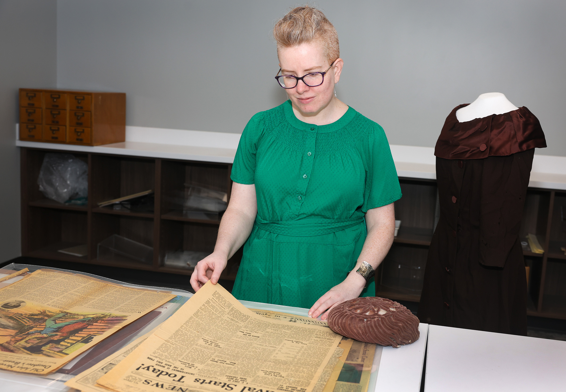 UNK archivist Laurinda Weisse shows off items in the Mari Sandoz collection.