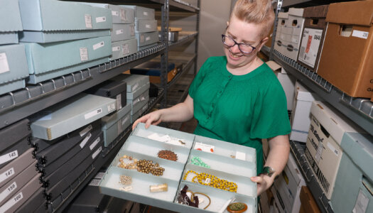UNK archivist Laurinda Weisse shows off items in the Mari Sandoz collection.