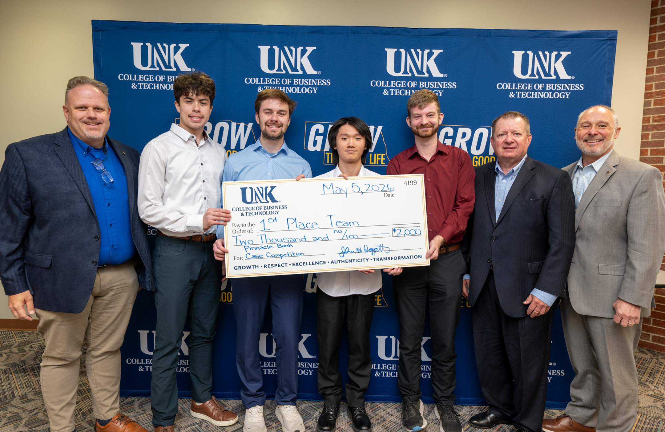 Pinnacle Bank representatives pose with winners of a UNK case competition.