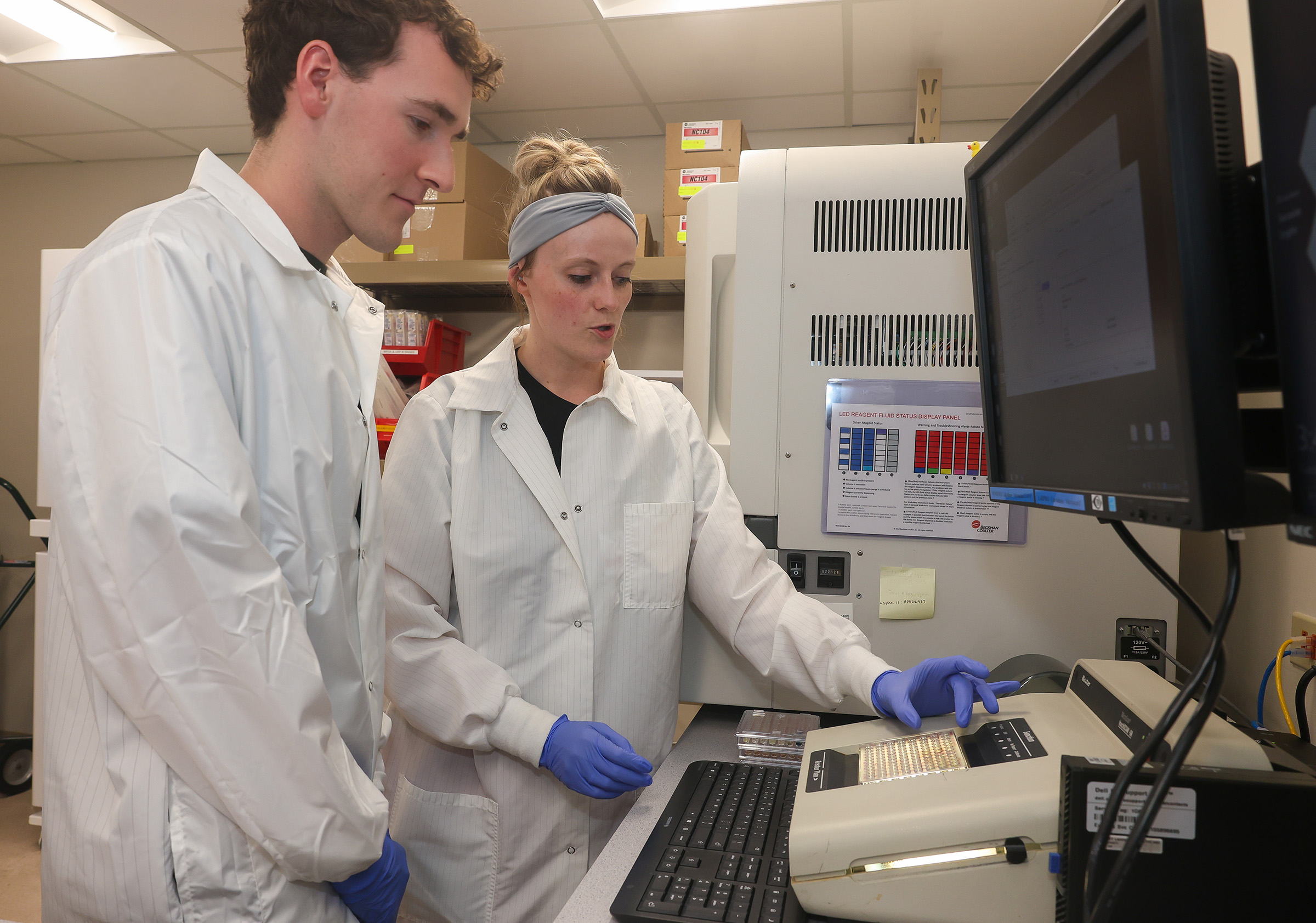 Lainey Wiedel, a medical laboratory technician at Mary Lanning Healthcare, shows UNK junior Rylan Nordby the microbiology lab during the Rural Immersion Program.