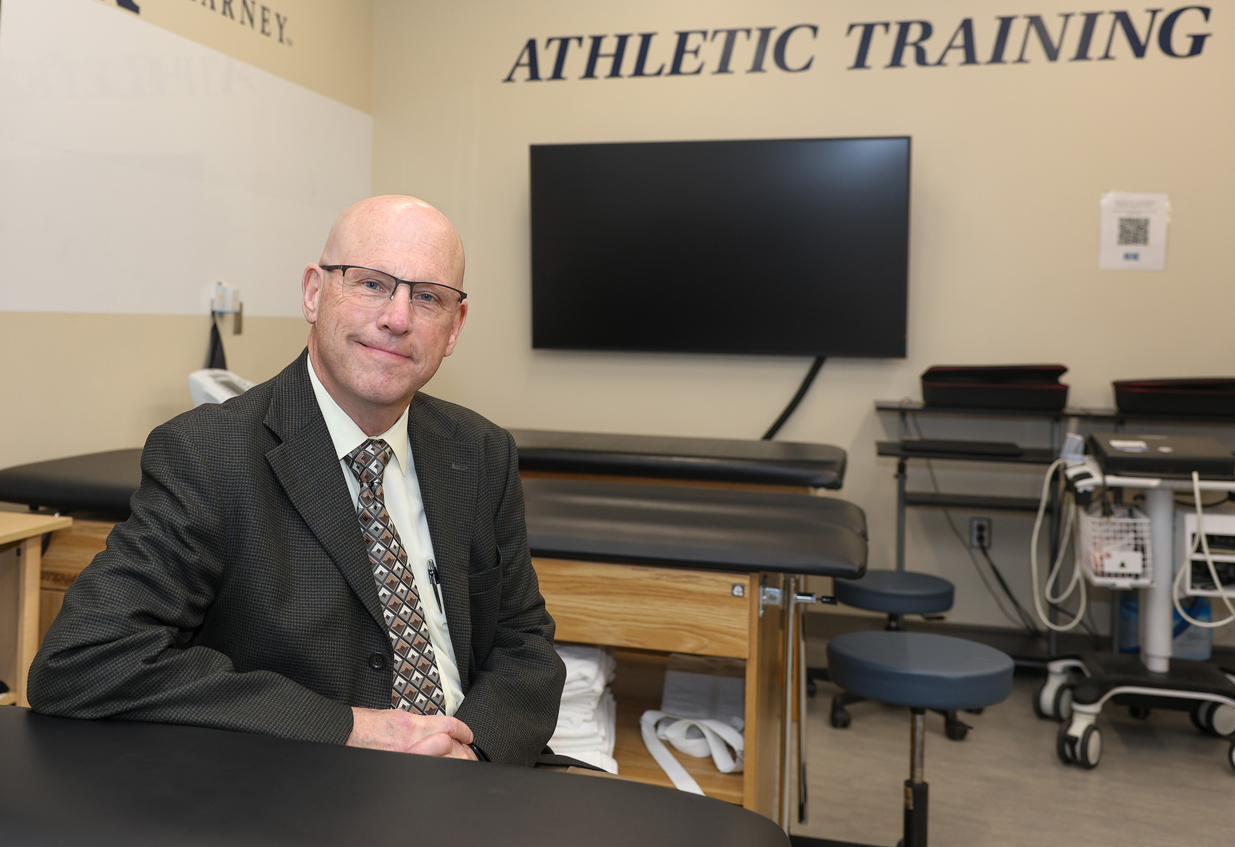 Scott Unruh poses for a photo in the UNK athletic training lab.