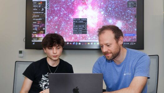 Andrew Yemma and Brandon Marshall work on their research project.