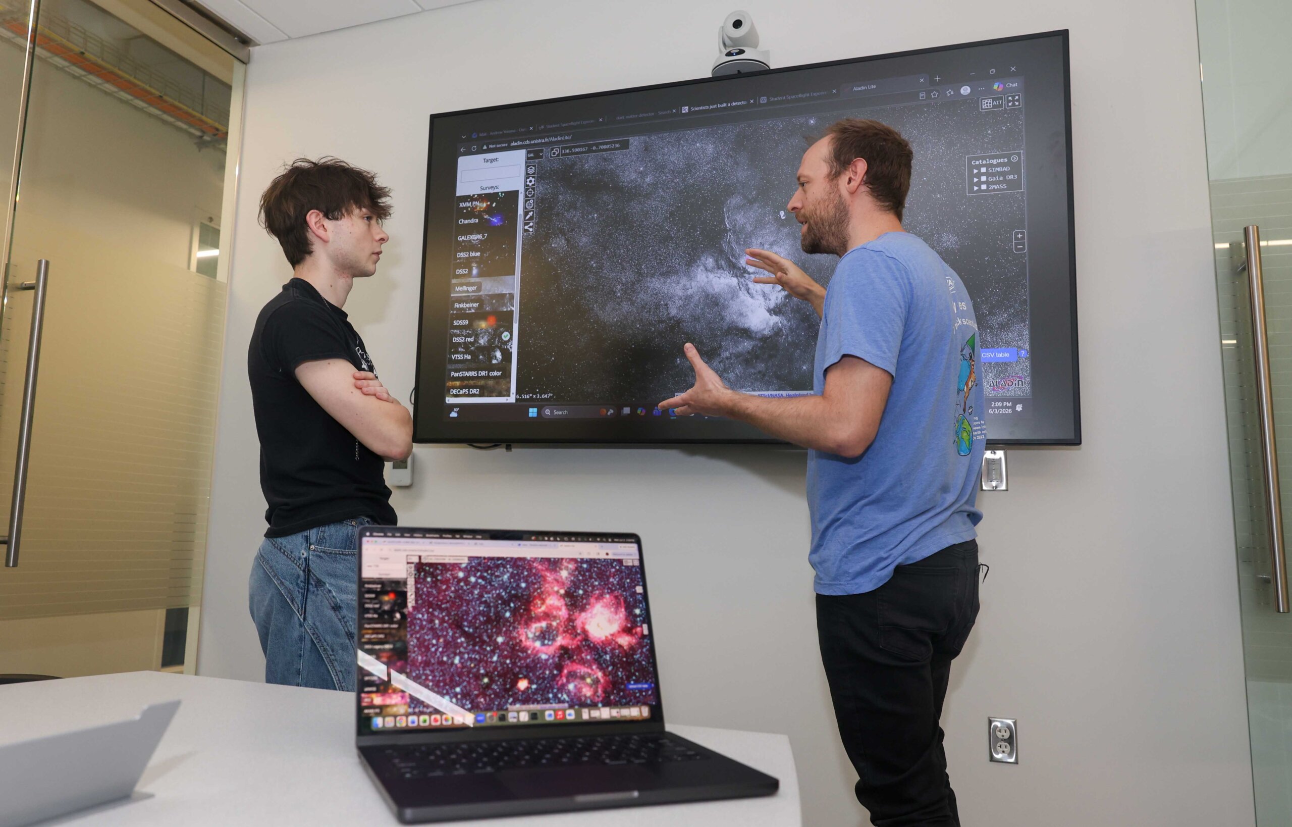 UNK junior Andrew Yemma and associate professor Brandon Marshall discuss their astrophysics research inside Discovery Hall.