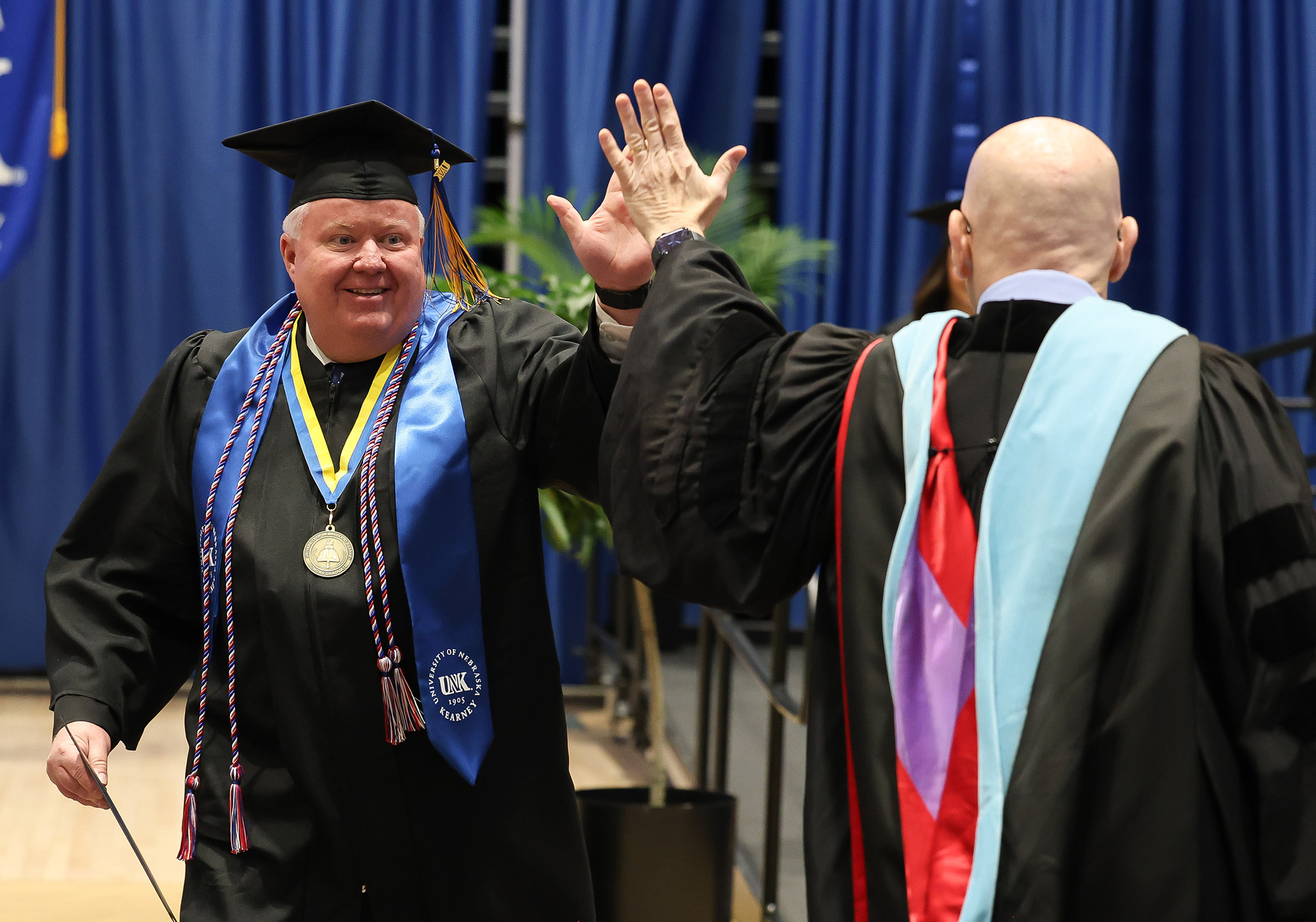 Ted Eichholz receives his bachelor's degree during last month's commencement ceremony at UNK.