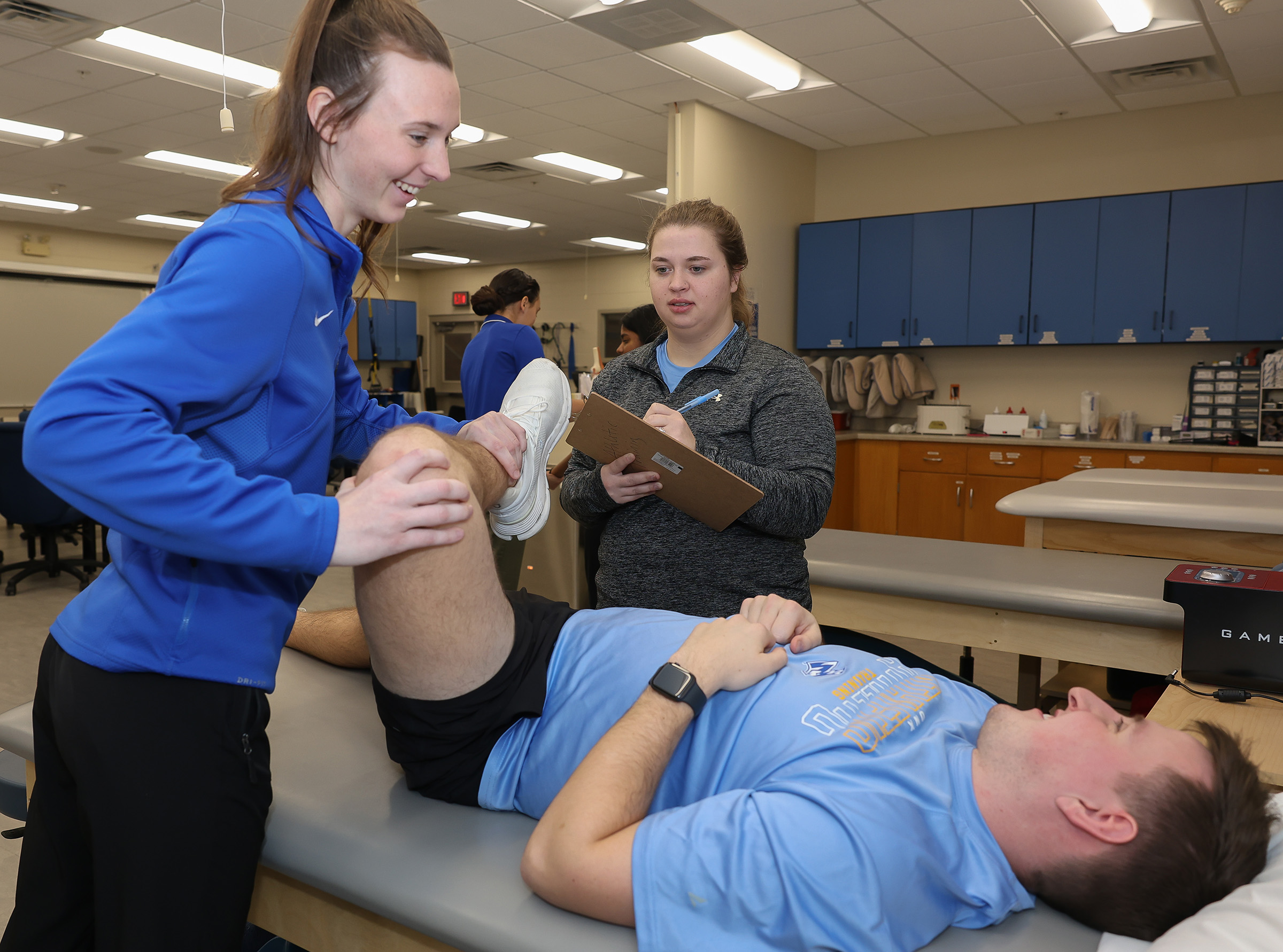UNK athletic training students practice their skills in the lab.