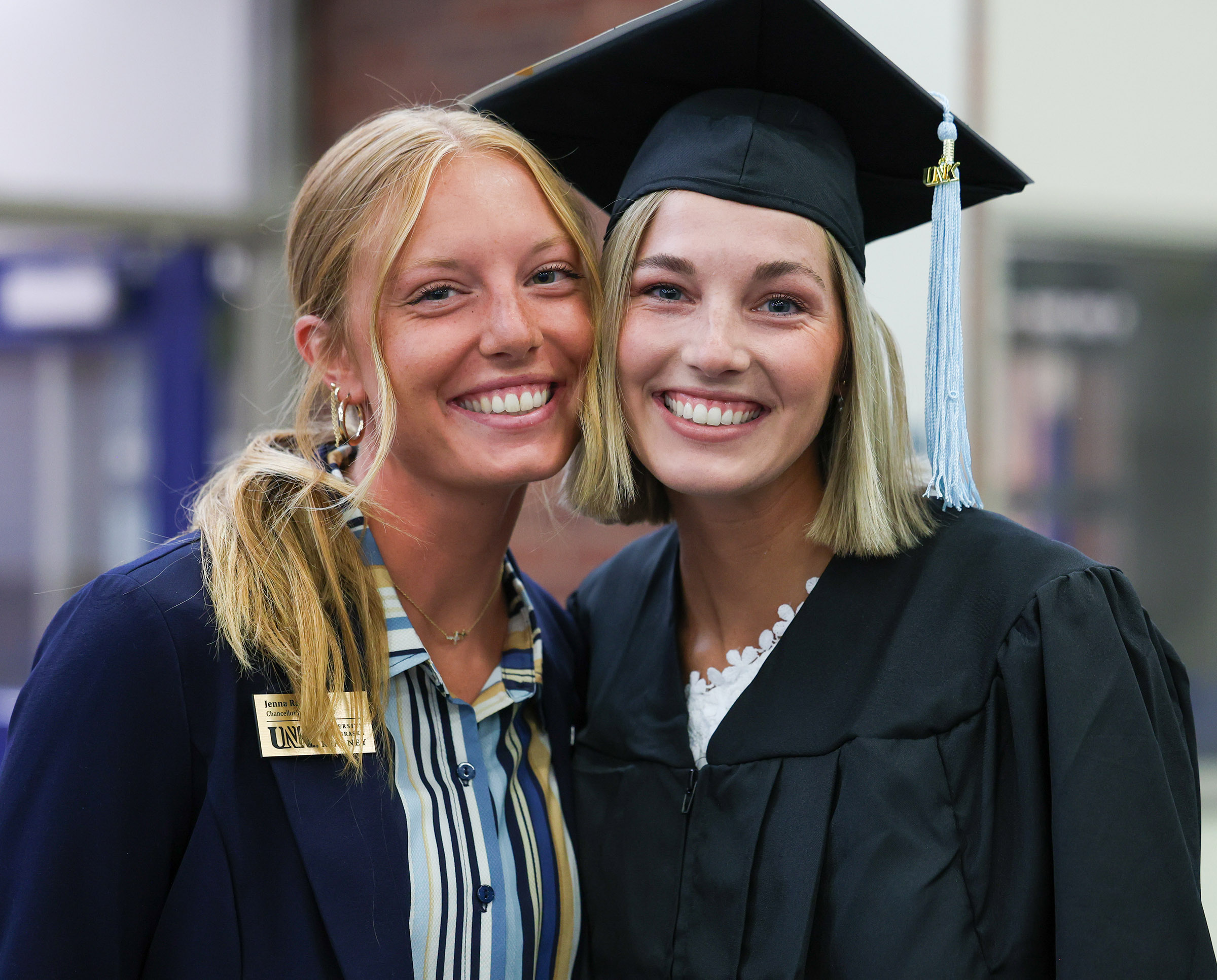 Jenna and Jocelyn Rauert are pictured during a UNK commencement ceremony.