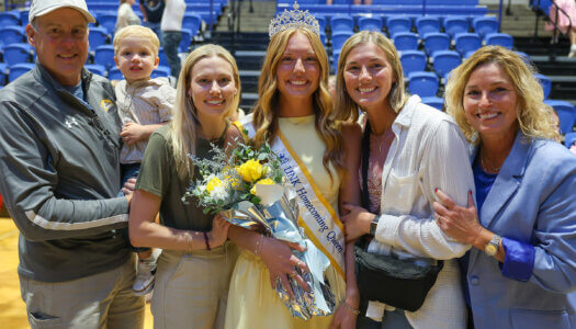 The Rauert family is pictured during the homecoming royalty crowning at UNK.