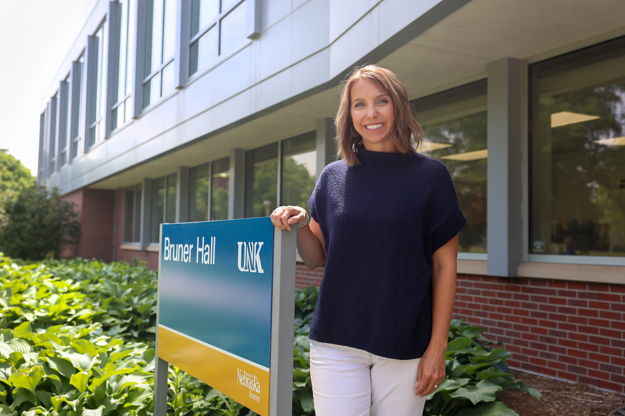 Sara Bruner poses for a photo outside Bruner Hall.