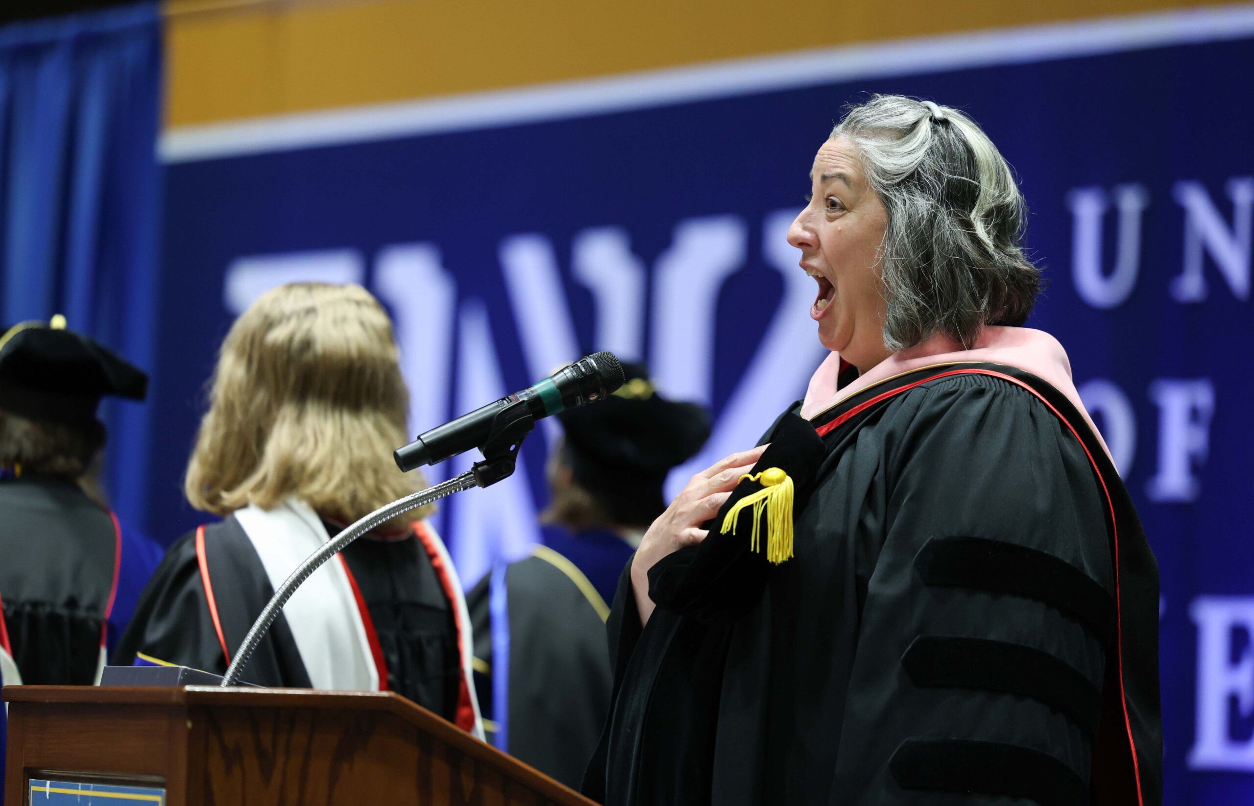 A woman sings the national anthem.