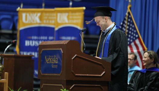 UNK graduate Gavyn Brauer speaks at commencement.