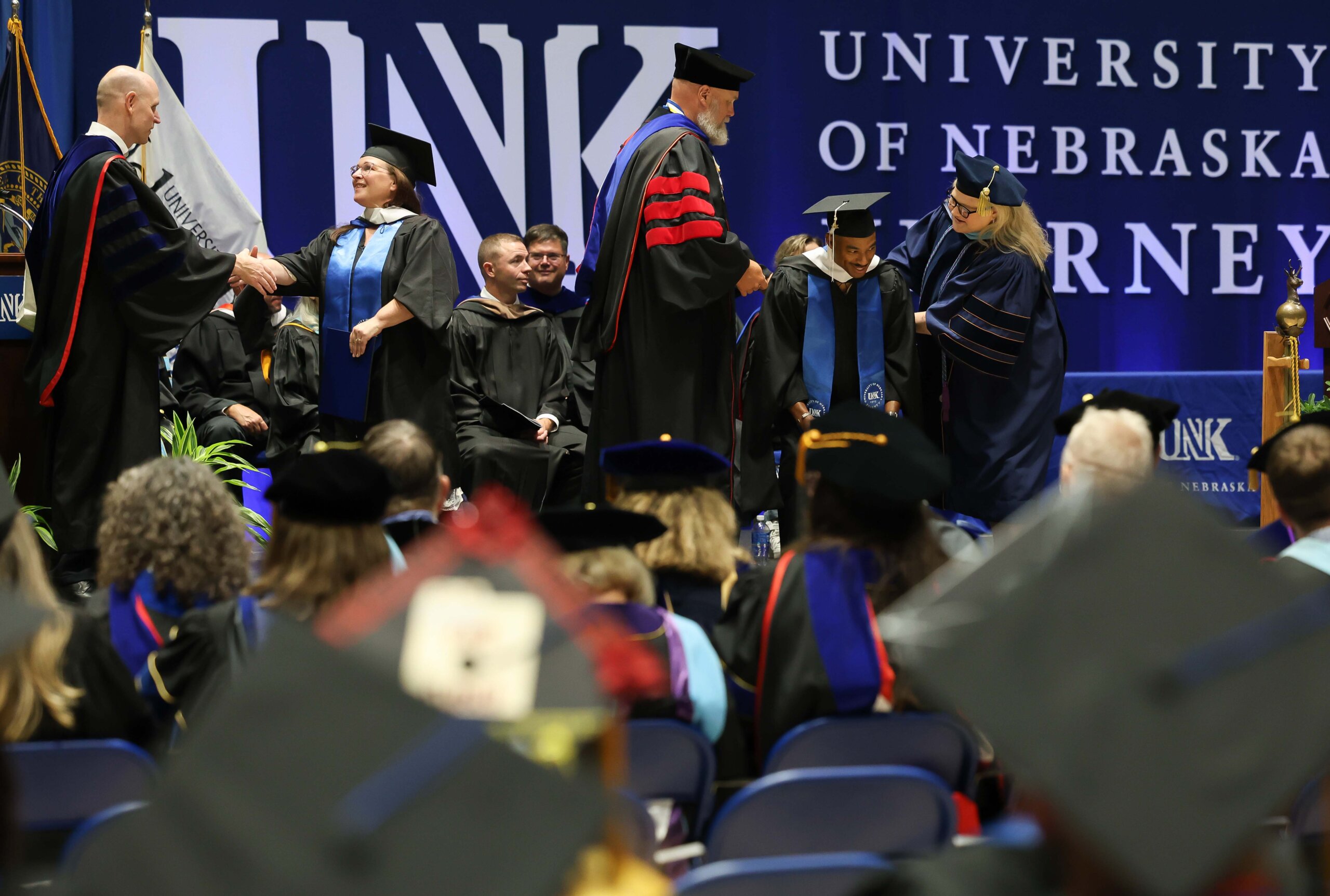 Students participate in summer commencement.