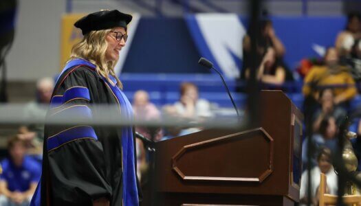 Dean of Graduate Studies and Academic Innovation Megan Adkins addresses the crowd.