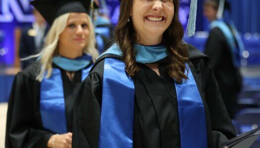 Students participate in summer commencement.