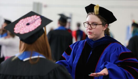 Associate Professor Amanda Sladek speaks with a student.