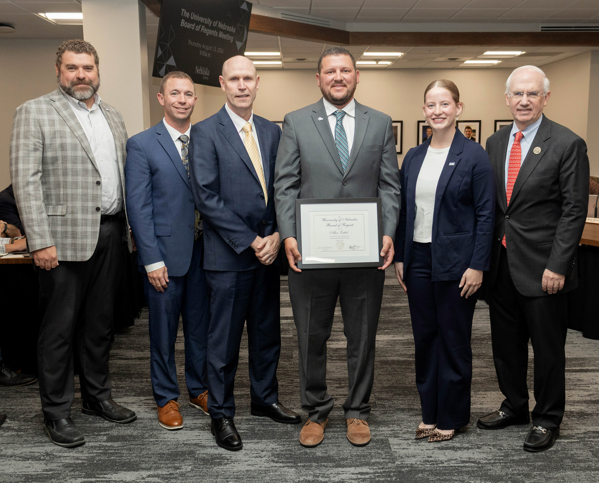 Alex Zabel receives the KUDOS award during today's NU Board of Regents meeting.